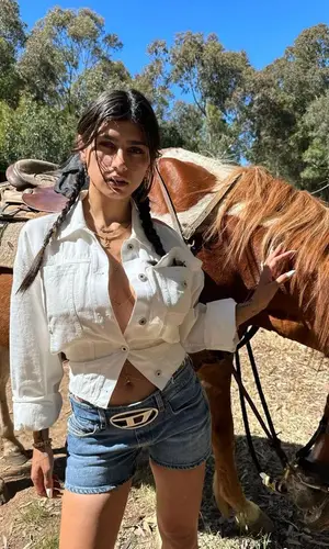 Mia Khalifa’s Outfit in Loewe Jacket, Diesel Shorts & Fendi Boots (2023)