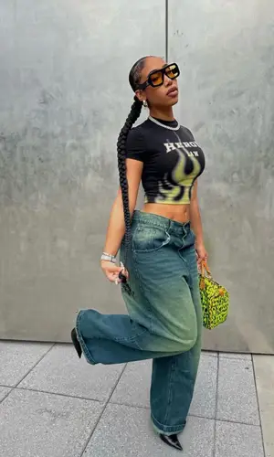 Kris Summers wearing Heron Preston t-shirt