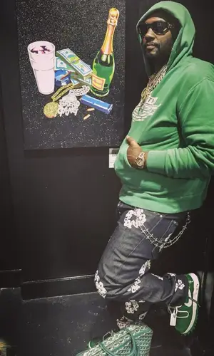 Peezy wearing Versace eyewear
