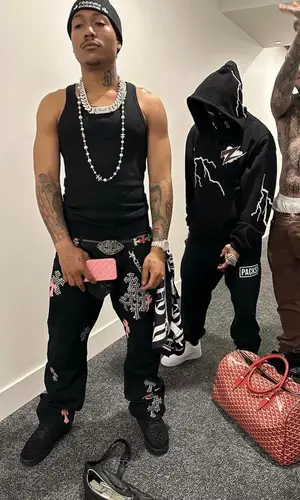 Lil Meech wearing Chrome Hearts belt