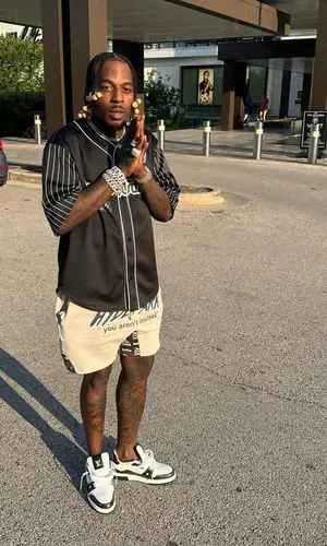Sauce Walka wearing Louis Vuitton shirt