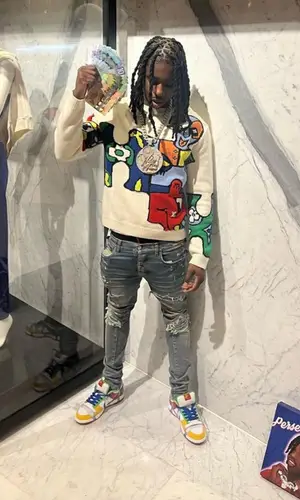 Polo G’s Outfit in Louis Vuitton Sweater, Amiri Jeans & Nike Sneakers (2023)
