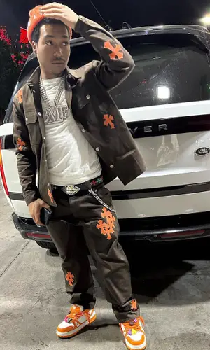 Lil Meech wearing Chrome Hearts jacket