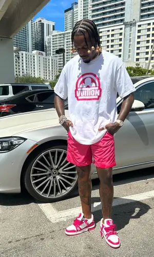 Sauce Walka wearing Louis Vuitton shorts