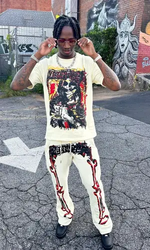 Yung Mal’s Outfit in Ricchezza Forever T-Shirt, Nike Sneakers & Cartier Eyewear (2023)
