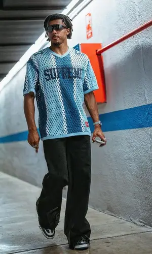 Jules Kounde’s Outfit in Supreme Jersey, Paradoxe Paris Jeans & Oakley Eyewear (2023)