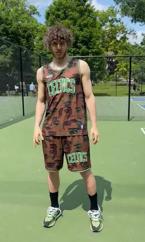 Jack Harlow’s Outfit in NBA Jersey, Bape Pants & KidSuper (2023)