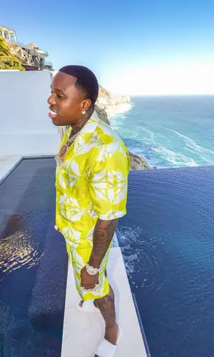 BandMan Kevo wearing Louis Vuitton shorts