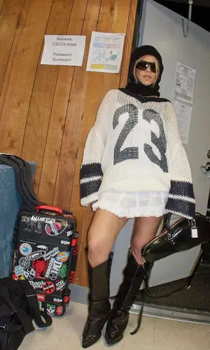 Kourtney Kardashian’s Outfit in Vaquera Sweater & R13 Boots (2023)