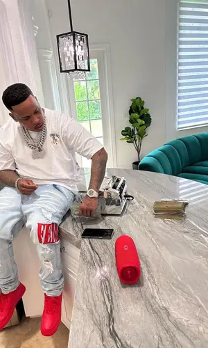 Finesse2tymes wearing Homme + Femme jeans