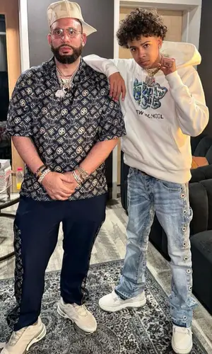 DJ Drama wearing Louis Vuitton shirt