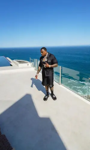 BandMan Kevo wearing Amiri shirt