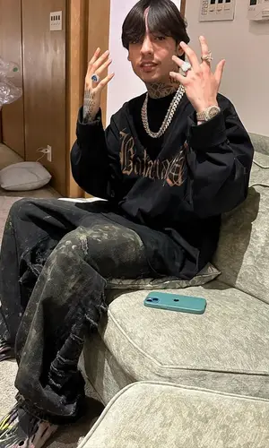 Natanael Cano wearing Balenciaga jeans
