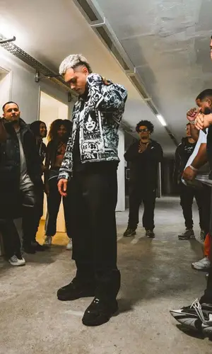Dallass wearing Prada pants