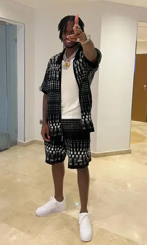 Krept wearing Supreme shirt