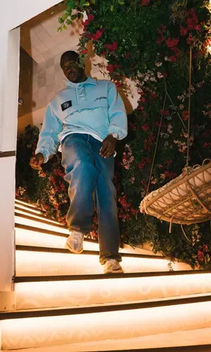 Pusha T wearing Louis Vuitton jacket