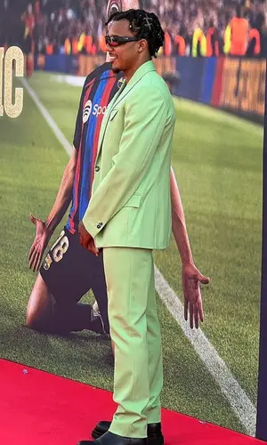 Jules Kounde wearing Bottega Veneta trousers