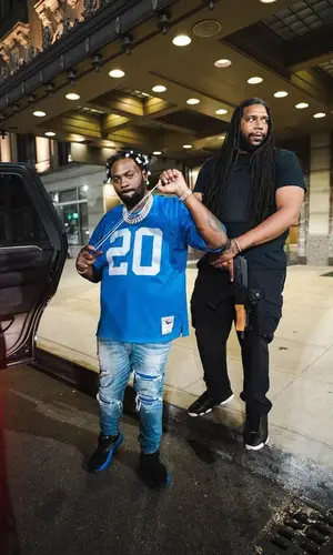 Peezy wearing Mitchell & Ness jersey