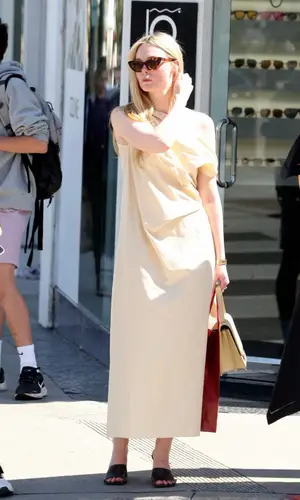 Elle Fanning wearing Cartier watch