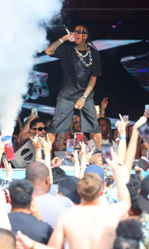 Tyga wearing Prada shorts