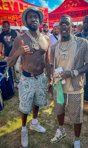 Meek Mill’s Outfit in Jordan Sneakers & Amiri Hat (2023)
