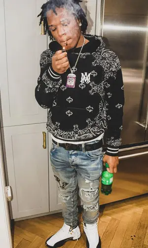 B Lovee wearing Louis Vuitton belt