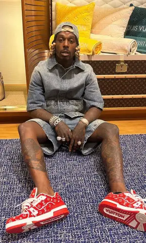 Sauce Walka wearing Louis Vuitton shirt