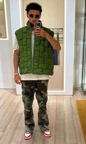 Curtis Jones wearing Gallery Dept. pants