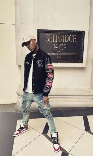 Kid Cudi’s Outfit in Julius Pants, Nike Sneakers & Human Made Cap (2023)