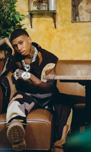 NLE Choppa wearing KidSuper boots