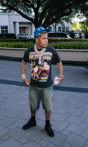 Devin Haney wearing Louis Vuitton shorts