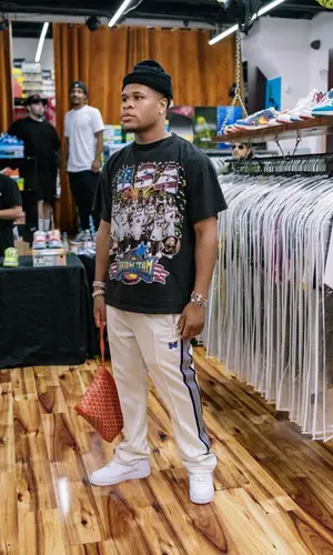 Devin Haney wearing Needles pants