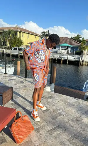Real Boston Richey wearing Rhude shirt