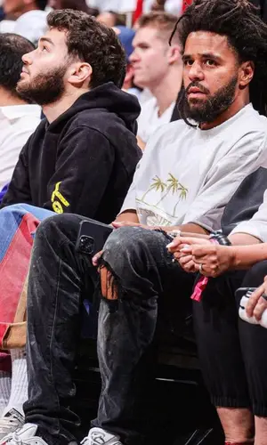 J. Cole wearing Glass Cypress jeans