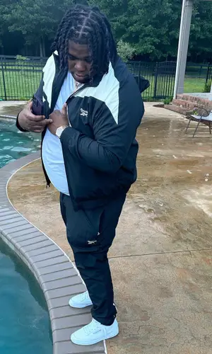 Big Homiie G wearing Reebok jacket