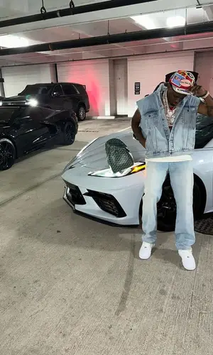 Real Boston Richey wearing Gucci jeans
