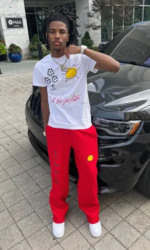 Lil Darius wearing Last Four pants