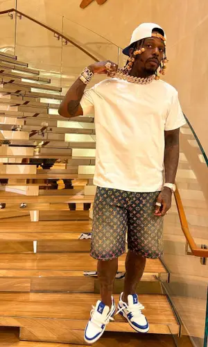 Sauce Walka wearing Louis Vuitton cap