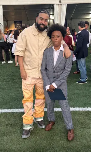 French Montana wearing Louis Vuitton shirt