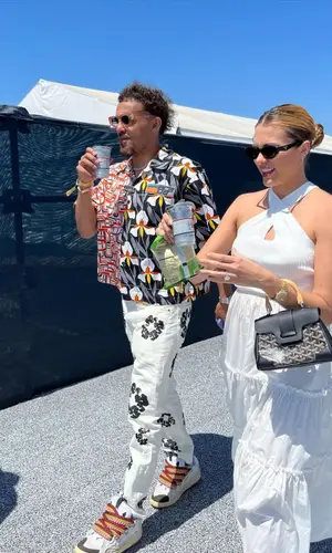 Trae Young wearing Prada shirt