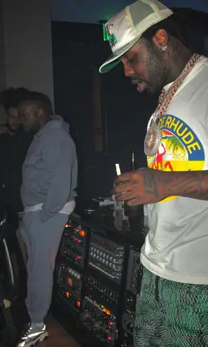 EST Gee’s Outfit in Raf Simons Sneakers & Rhude Cap (2023)