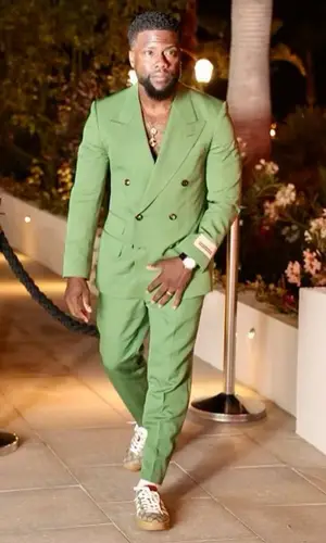 Kevin Hart wearing Gucci trousers