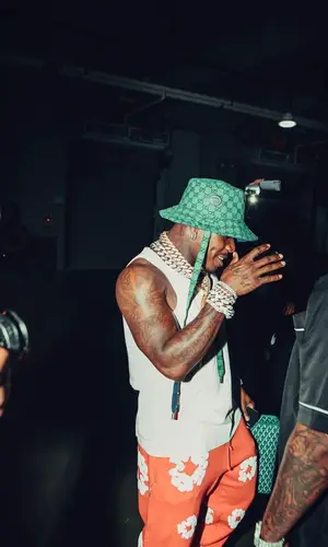 DaBaby wearing Goyard bag