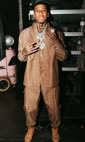 NLE Choppa wearing Versace trousers