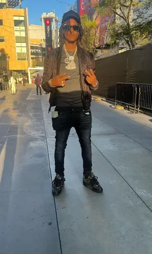 Skilla Baby wearing Louis Vuitton cap