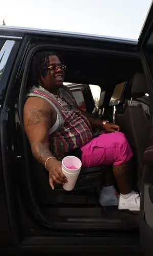 Big Homiie G wearing Supreme shorts