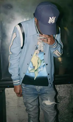 Lil Poppa wearing Amiri t-shirt