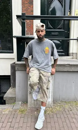 Nicky Jam’s Outfit in John Elliott Pants, Asics Sneakers & Gallery Dept. Socks (2023)