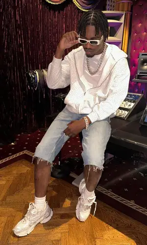 Lil Tjay wearing Balenciaga eyewear