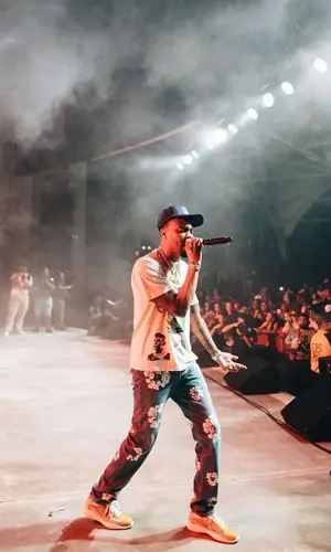 G Herbo wearing Gallery Dept. cap